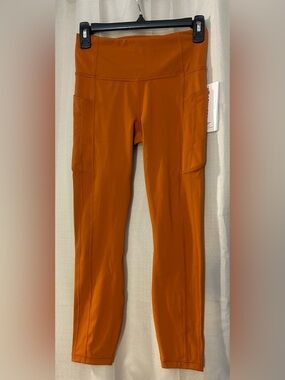 NWT Athleta Ultimate Stash Il 7/8
Tight Leggings Foliage Orange SP